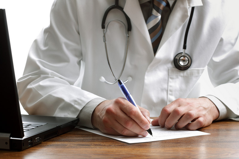 Doctor writing a content plan for website blog